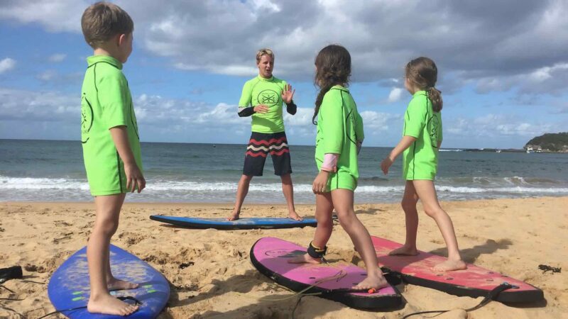 Activities on the Central Coast: Children learning to surf at Copacabana, Central Coast NSW with Central Coast Surf Academy